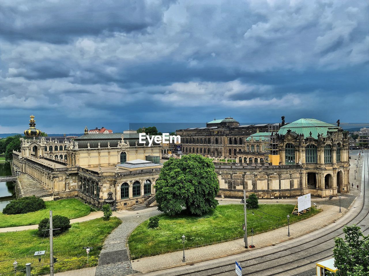 BUILDINGS AGAINST CLOUDY SKY