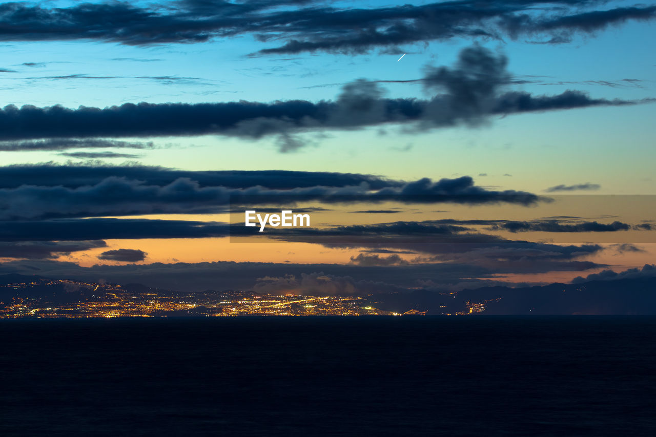 SCENIC VIEW OF SEA AGAINST ORANGE SKY