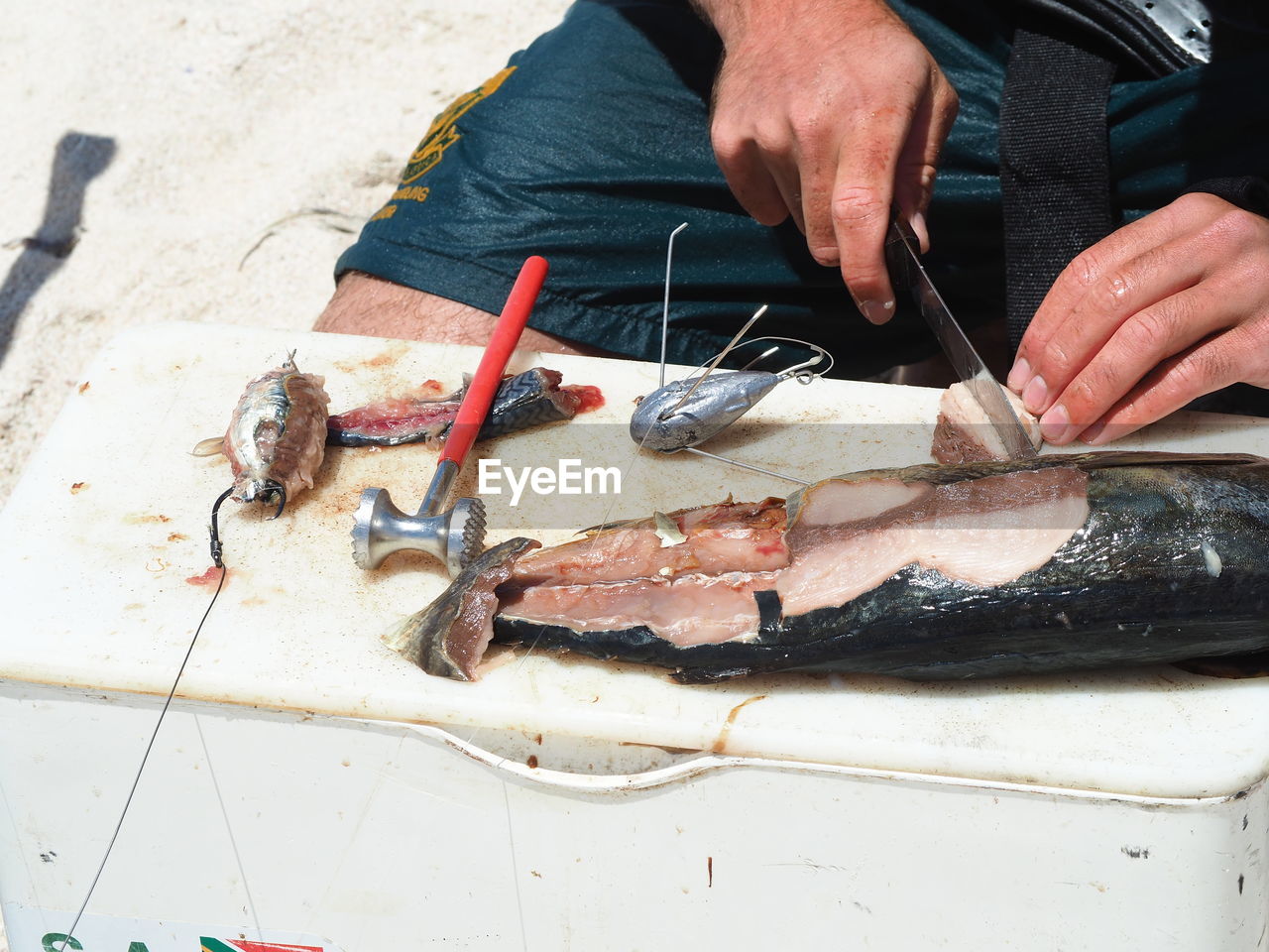 MAN HOLDING FISH