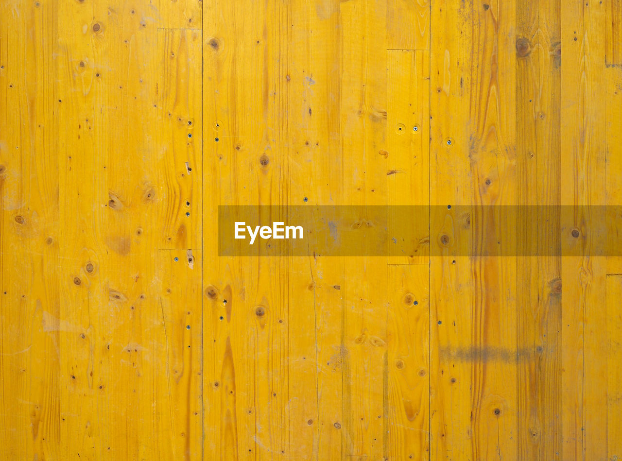 yellow, backgrounds, wood, full frame, textured, pattern, no people, wall - building feature, floor, plank, abstract, close-up, wood grain, old, built structure, architecture, wood stain, copy space, hardwood, striped, weathered, flooring, material, wall, brown, rough, line, outdoors, colored background, wood paneling, textured effect, vibrant color