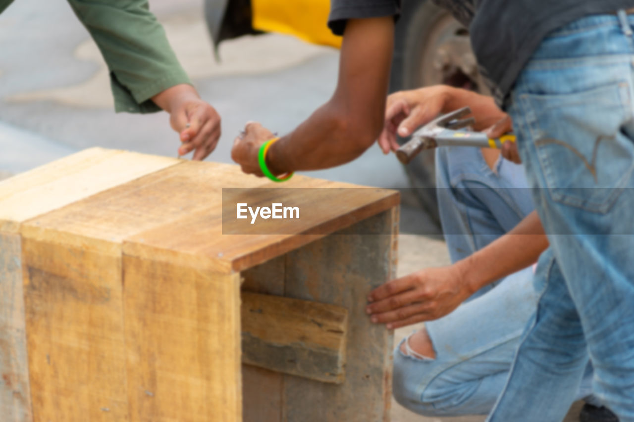 low section of man working at workshop