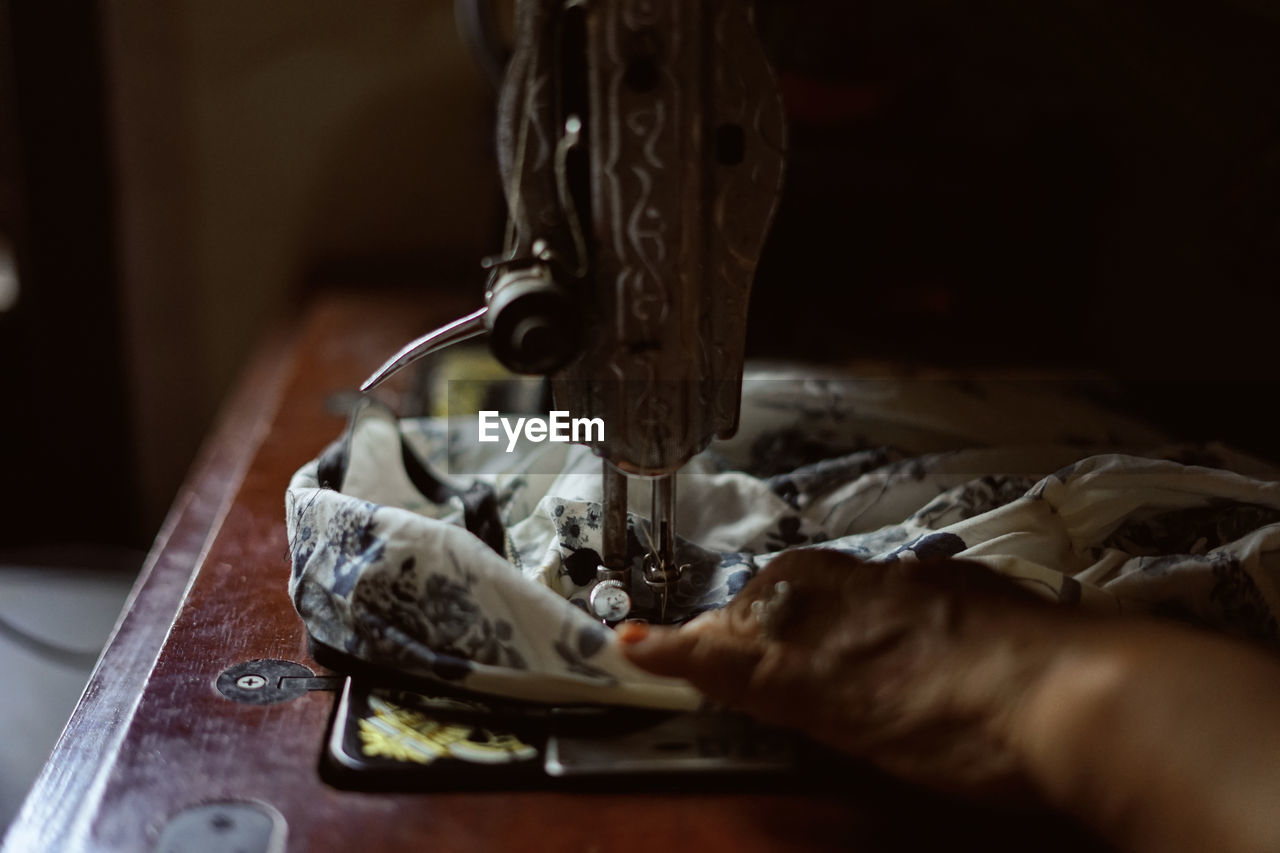 Cropped hand stitching fabric on sewing machine