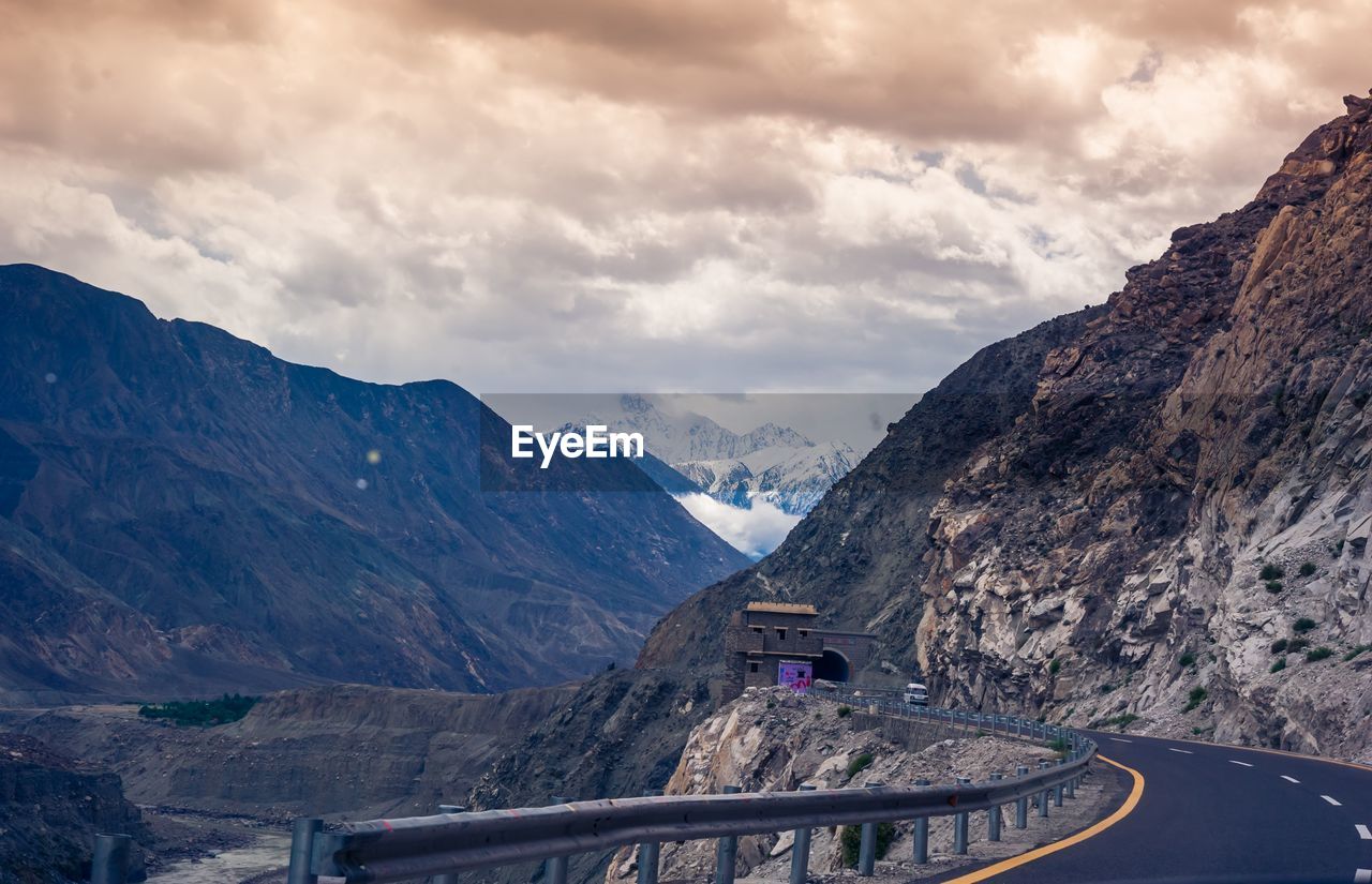 Road amidst mountains against sky