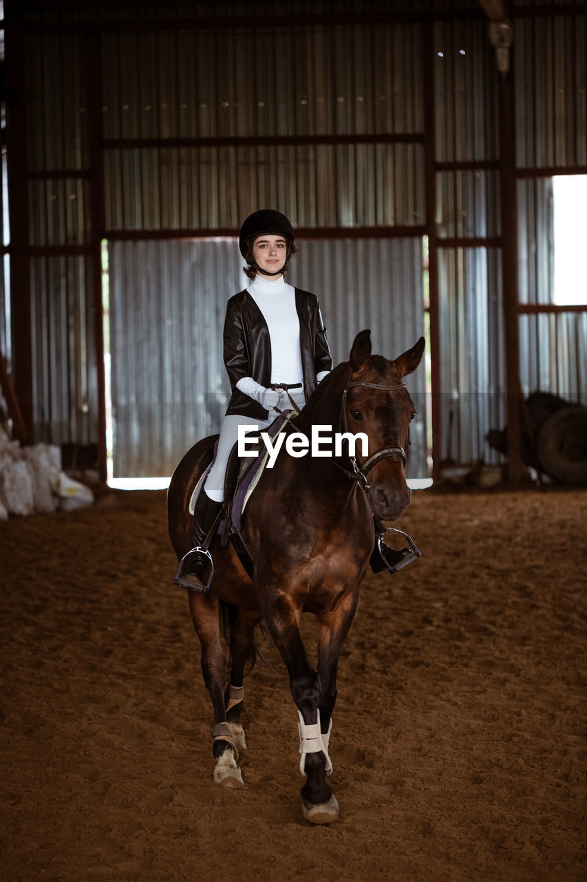 Portrait of woman riding horse