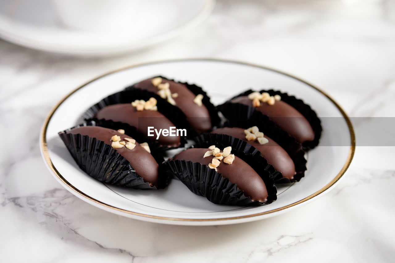 Close-up of chocolates in plate on table