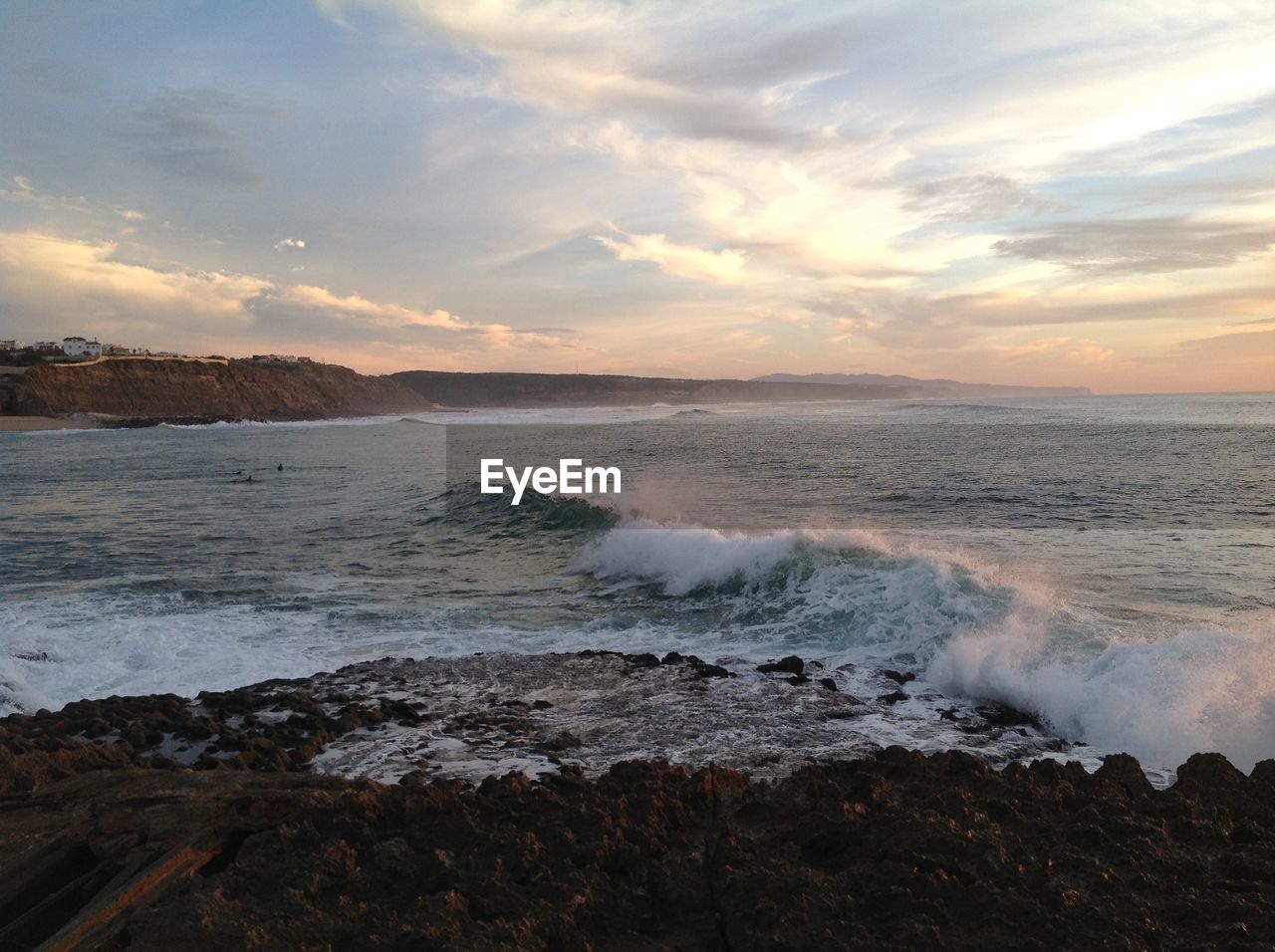 SCENIC VIEW OF BEACH DURING SUNSET