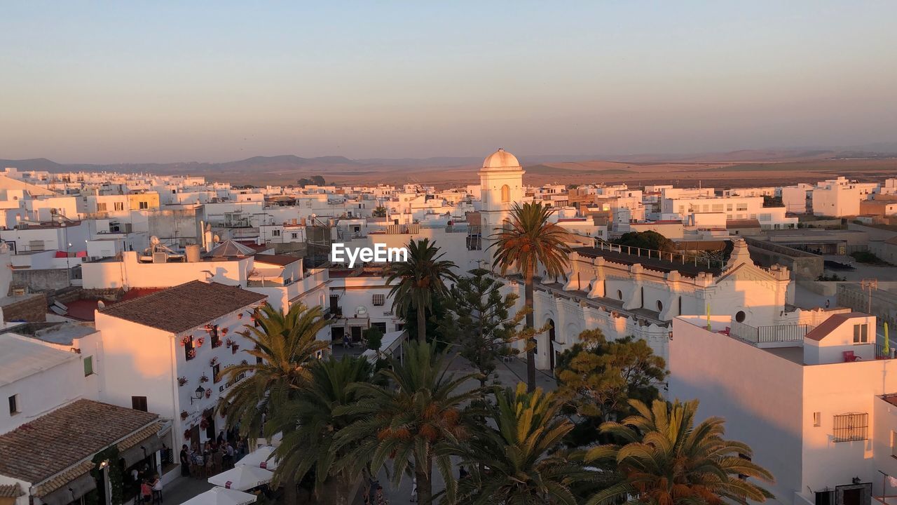 High angle view of buildings against sky at sunset