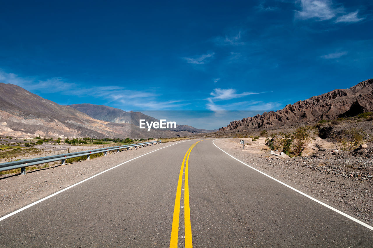 Road amidst landscape against sky