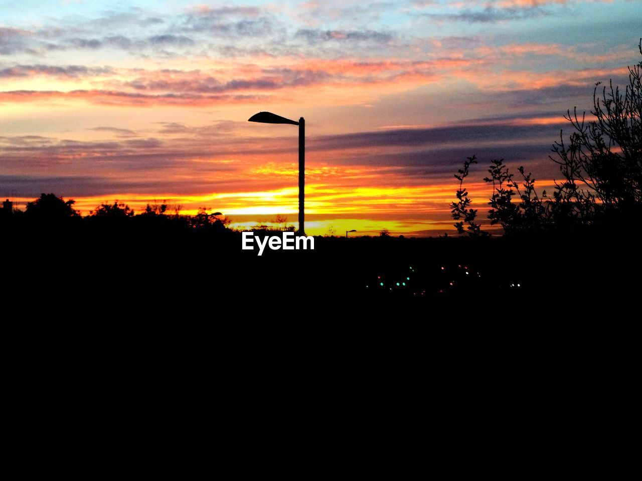 SCENIC VIEW OF SILHOUETTE TREES AGAINST SKY DURING SUNSET