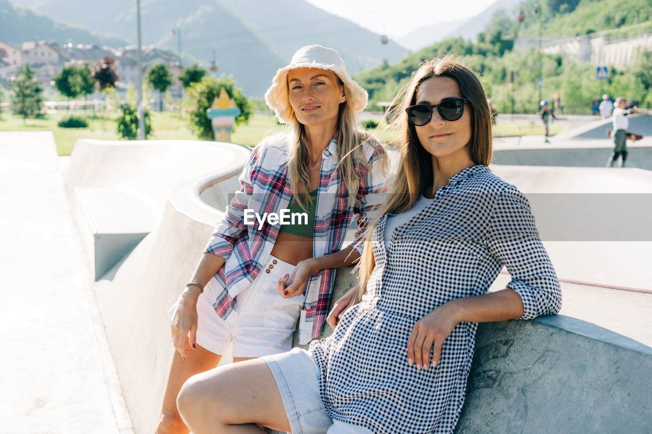 Two stylish hipster caucasian women outdoors.