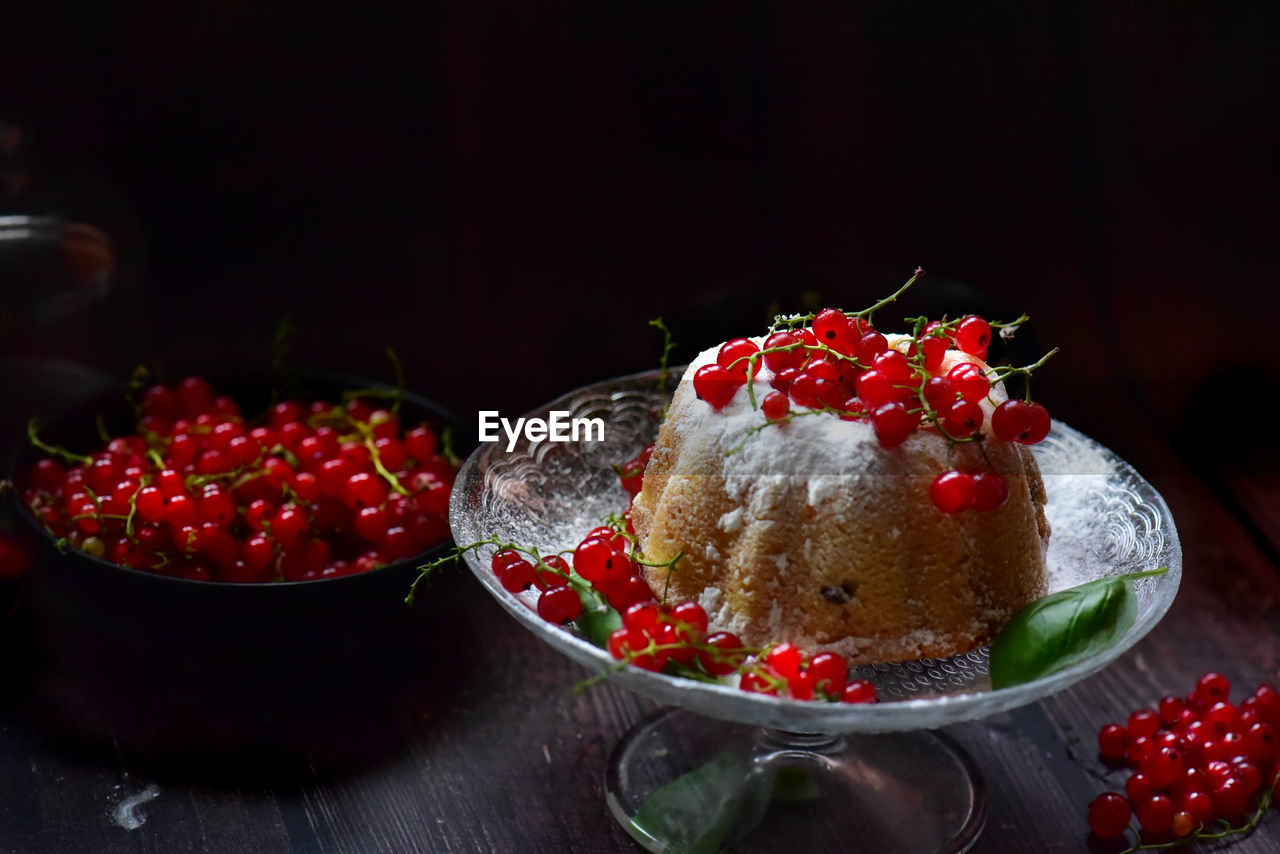 Close-up of dessert with currants in plate on table