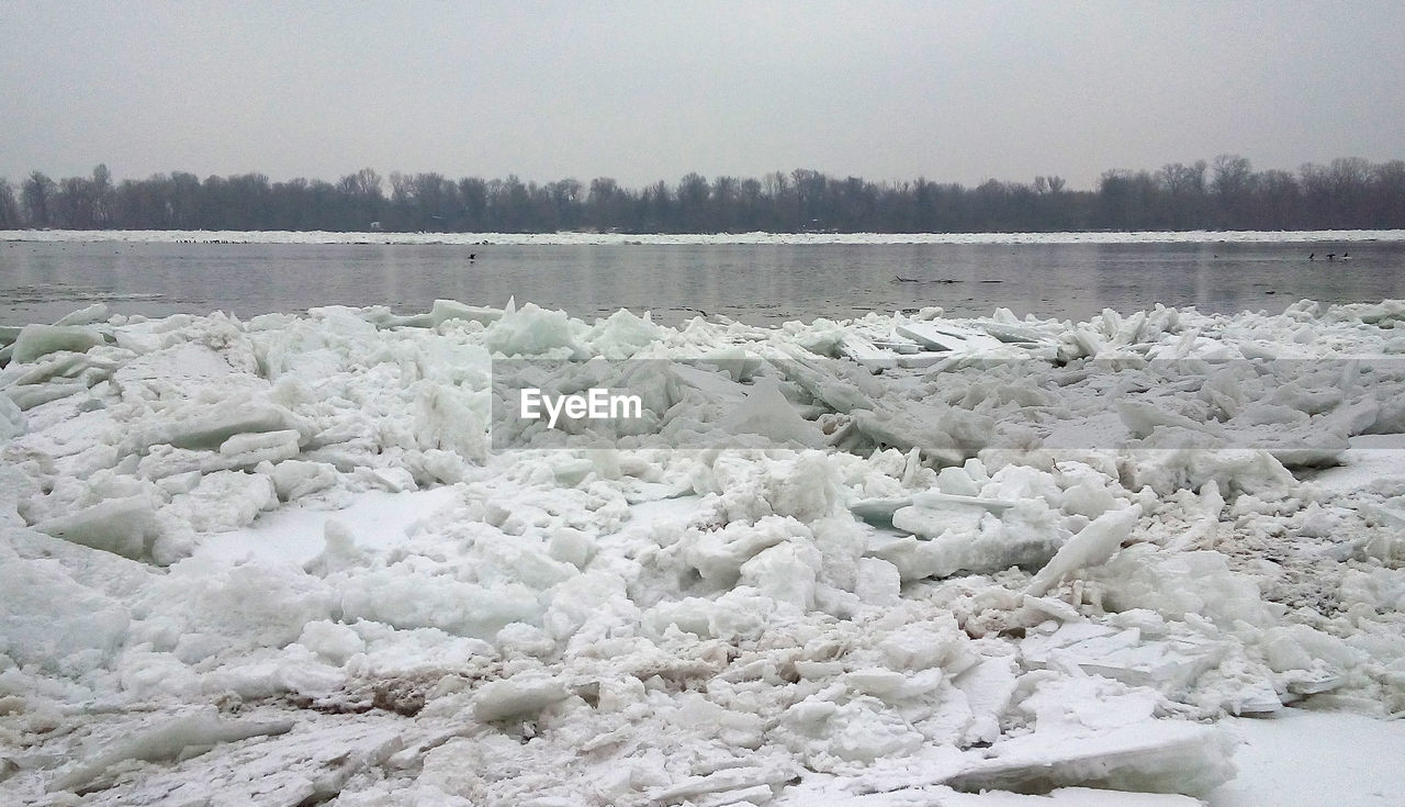 FROZEN RIVER AGAINST SKY