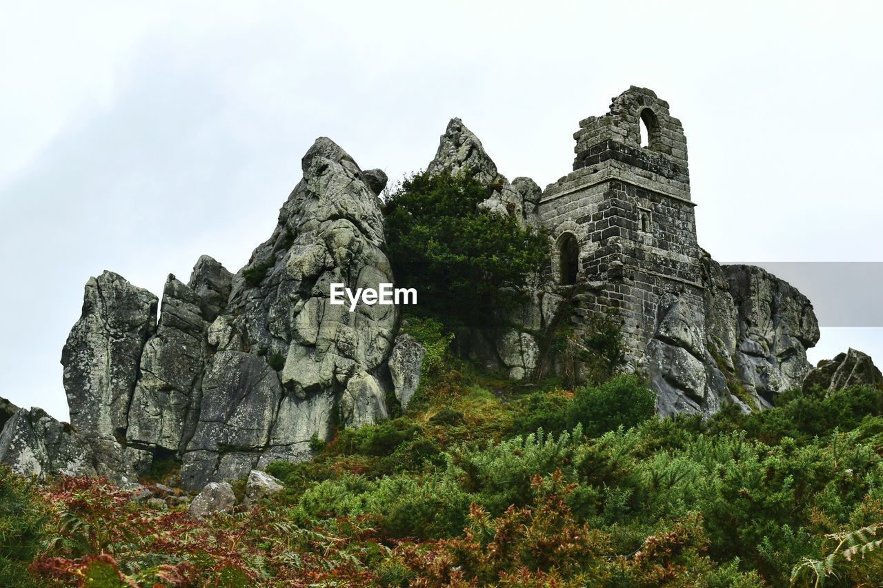 LOW ANGLE VIEW OF ROCK FORMATIONS