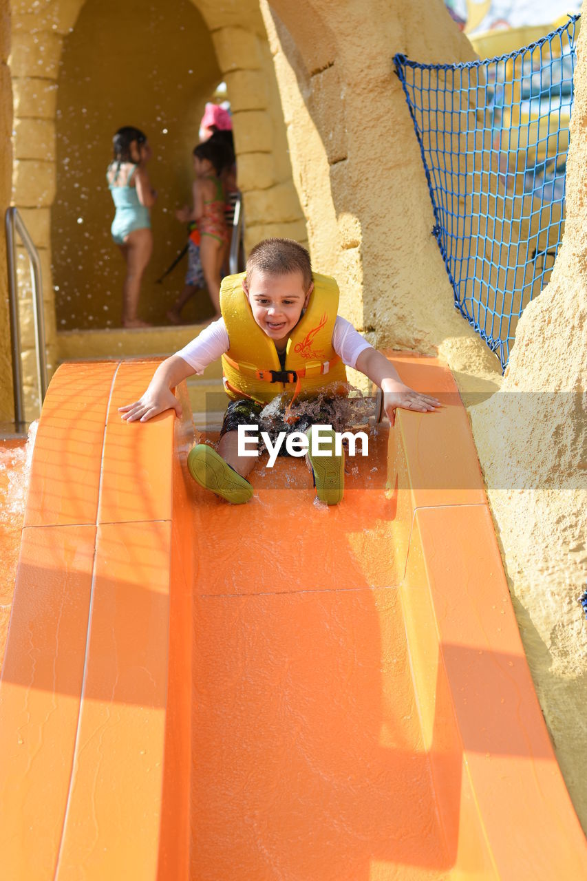 Full length of excited boy on slide at hersheypark