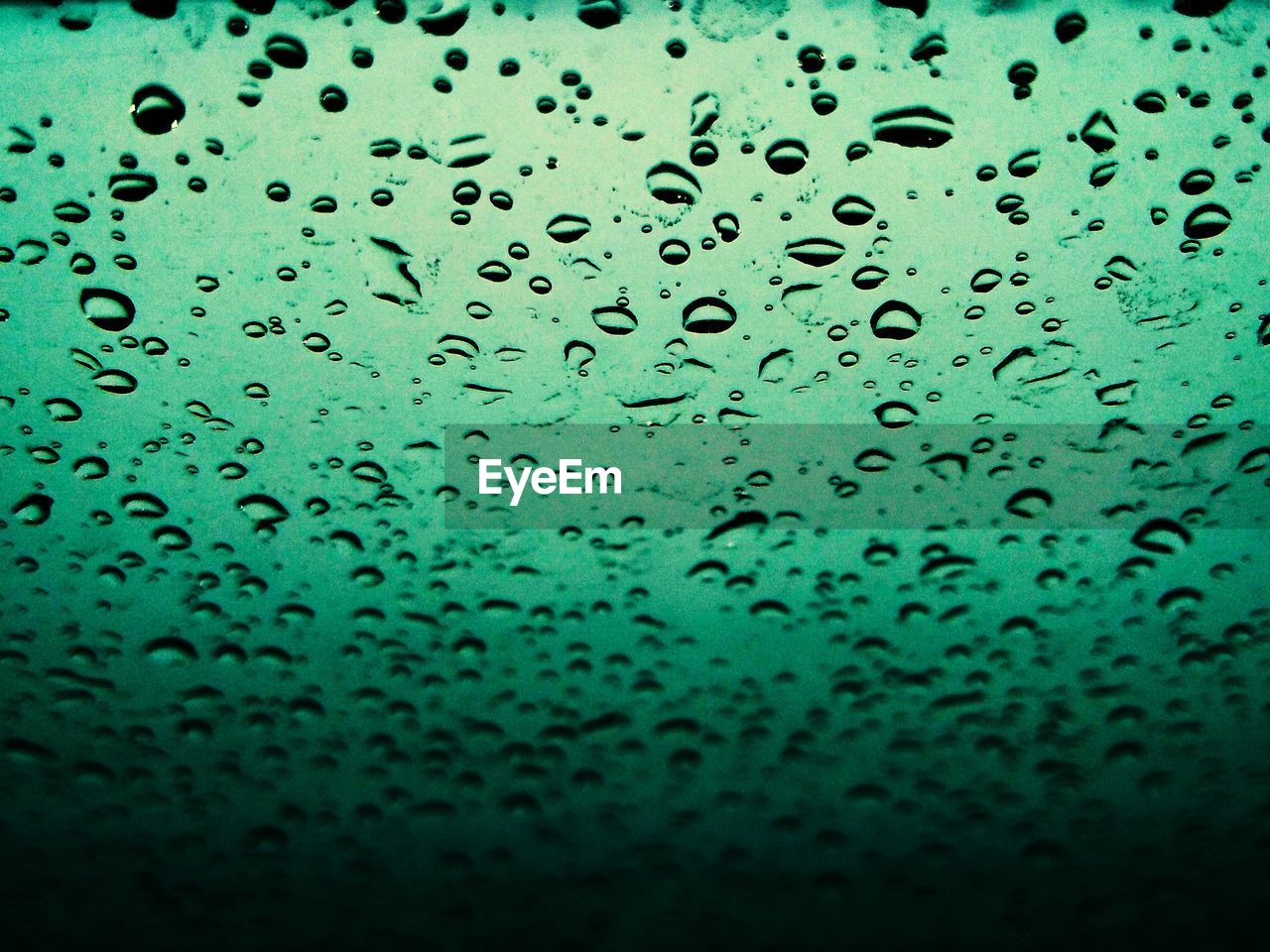 RAINDROPS ON GLASS WINDOW