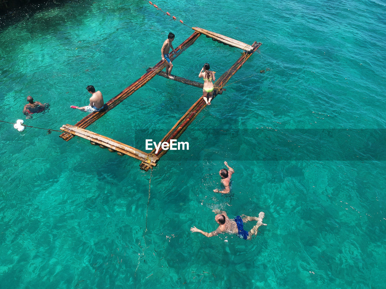 High angle view of people swimming in sea