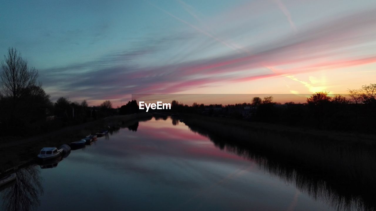 SCENIC VIEW OF RIVER DURING SUNSET