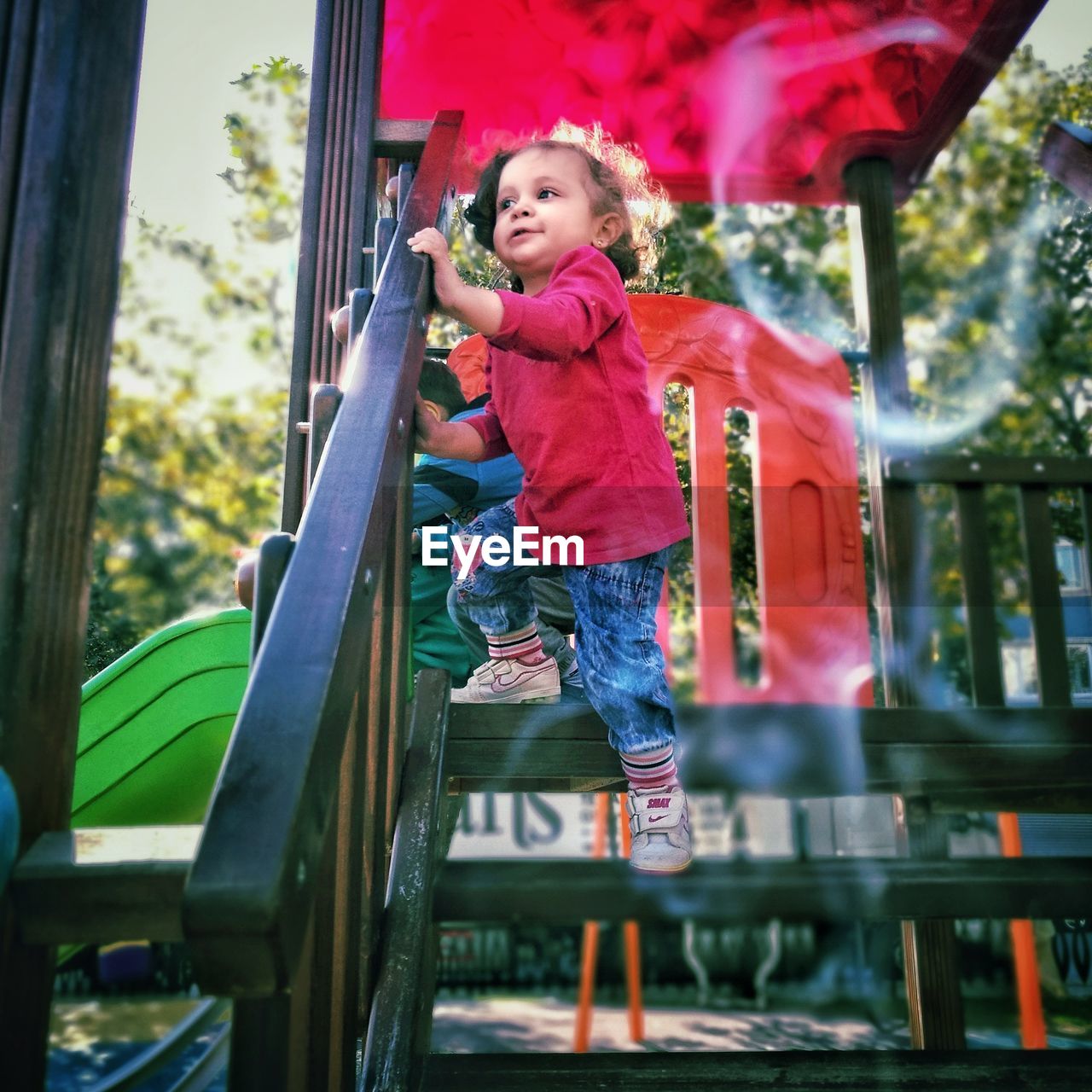 Low angle view of baby girl playing in park