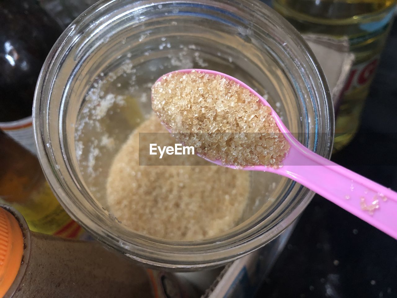 High angle view of sugar in jar on table