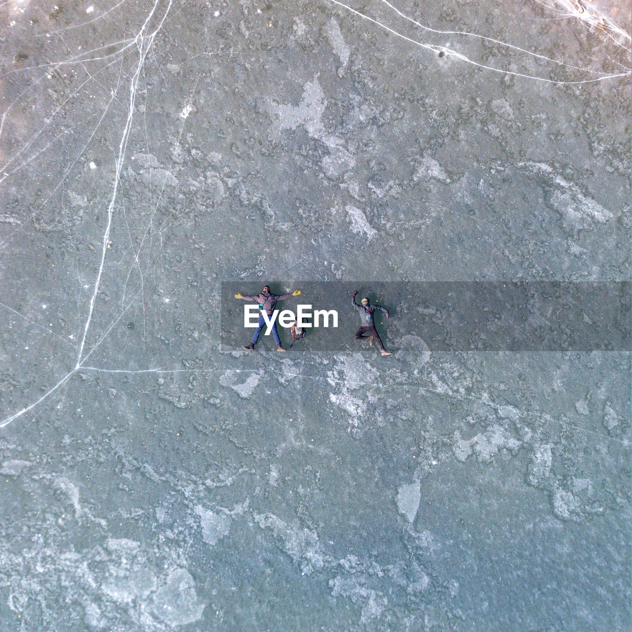 Aerial view of people lying on land