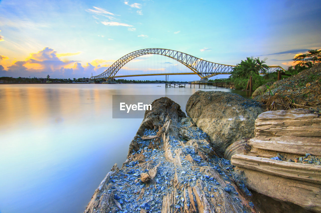 Bridge over river against sky