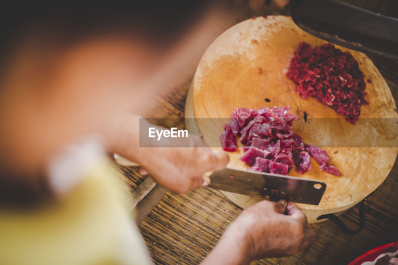 Close-up of man preparing food