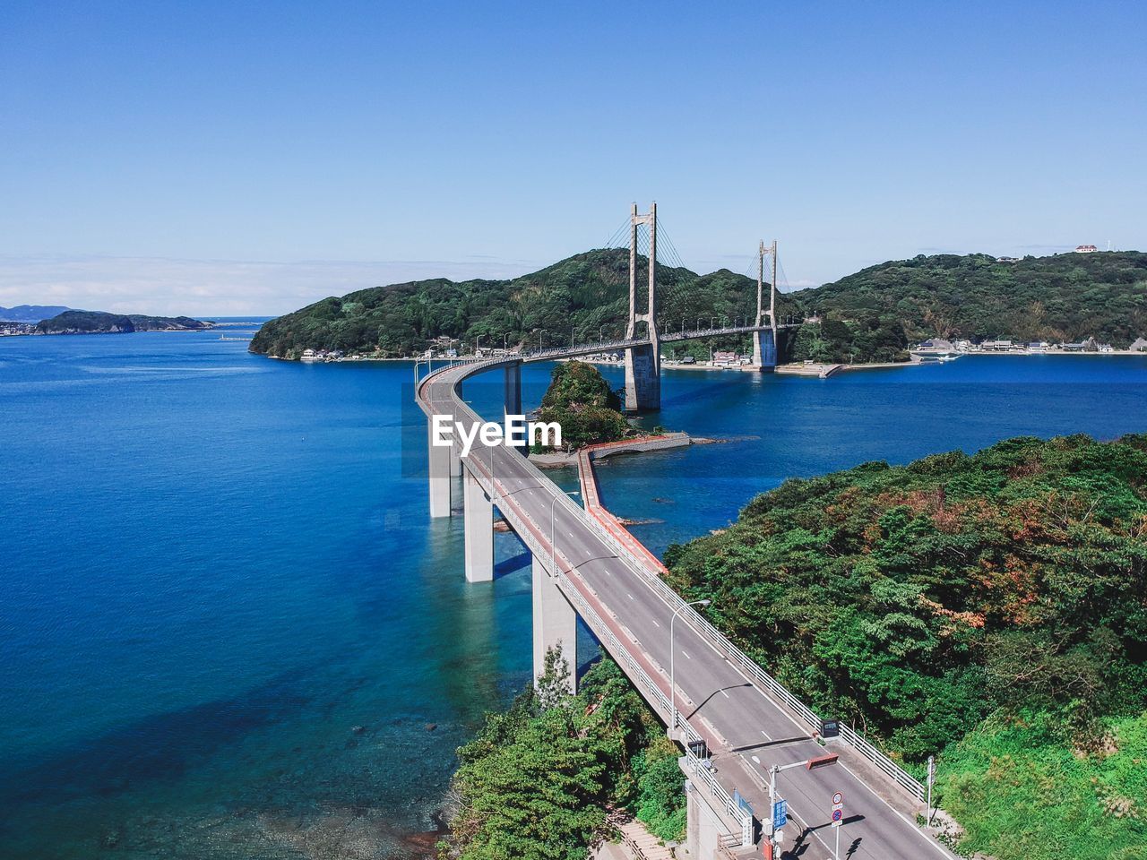 Scenic view of bay against blue sky