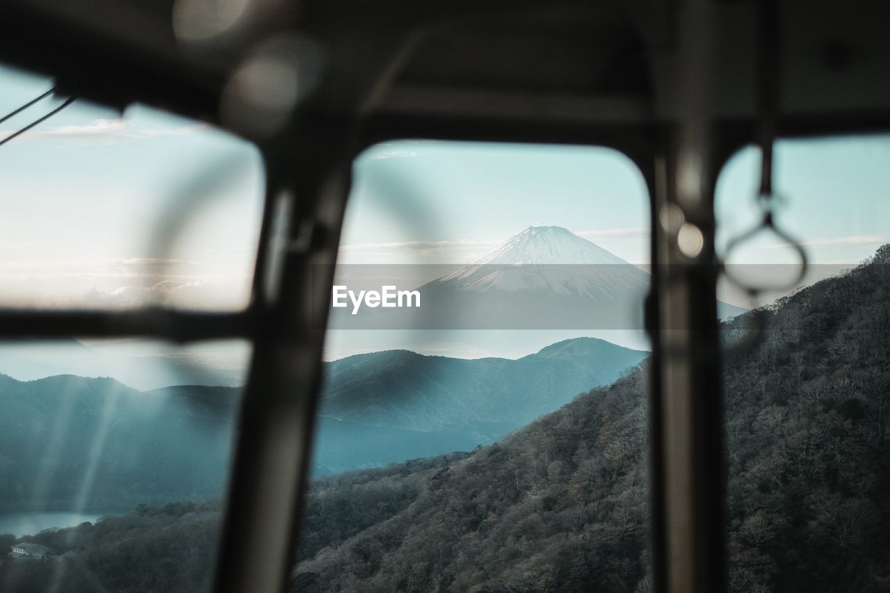 Close-up of mountains against sky seen from overhead cable car