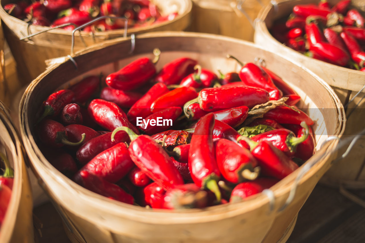 Close-up of red chili peppers in basket