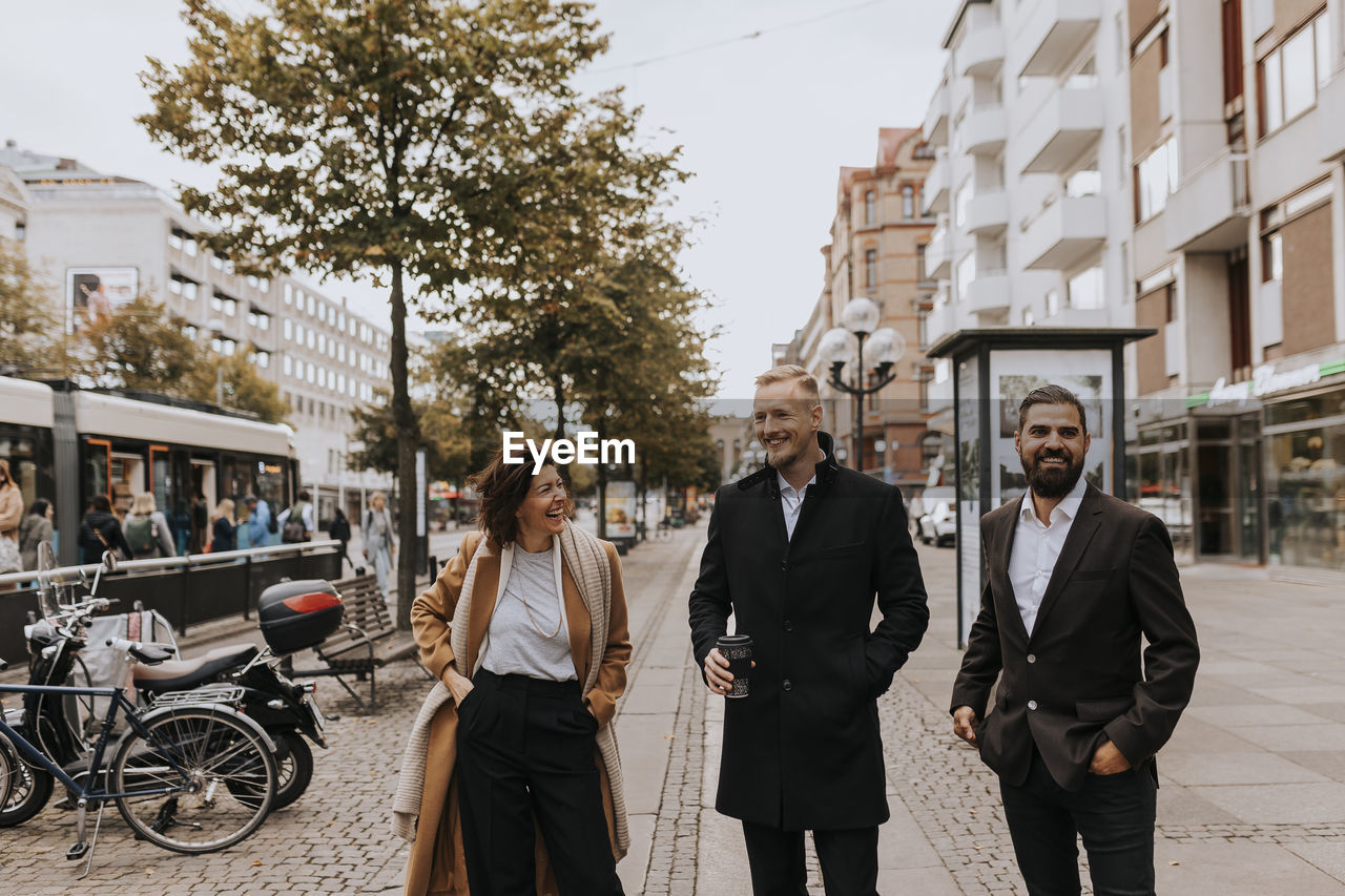 Smiling business people standing together