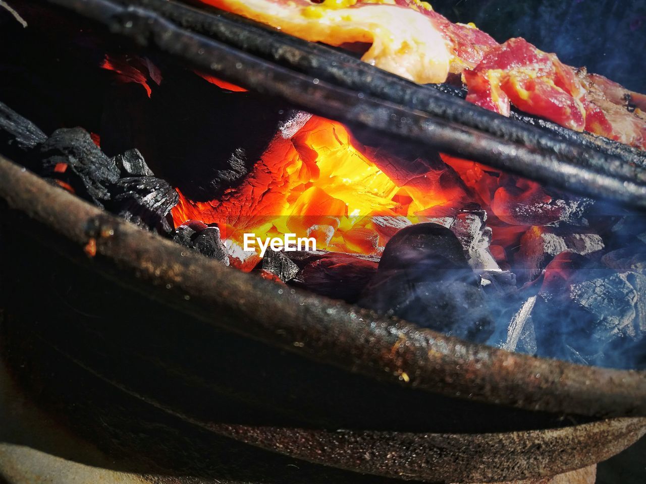 CLOSE-UP OF WORKING ON BARBECUE