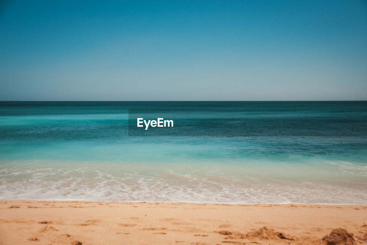 Scenic view of sea against clear sky