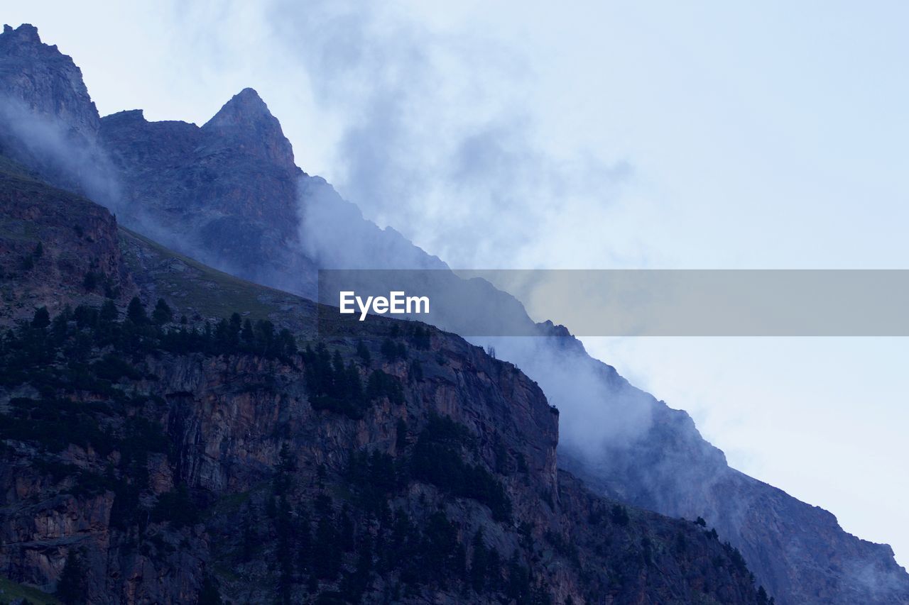 SCENIC VIEW OF MOUNTAINS DURING WINTER
