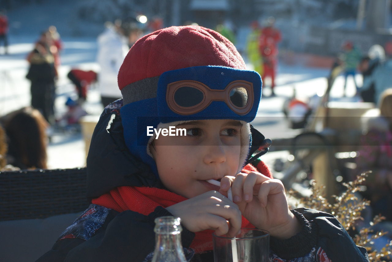 CLOSE-UP PORTRAIT OF BOY WEARING MASK