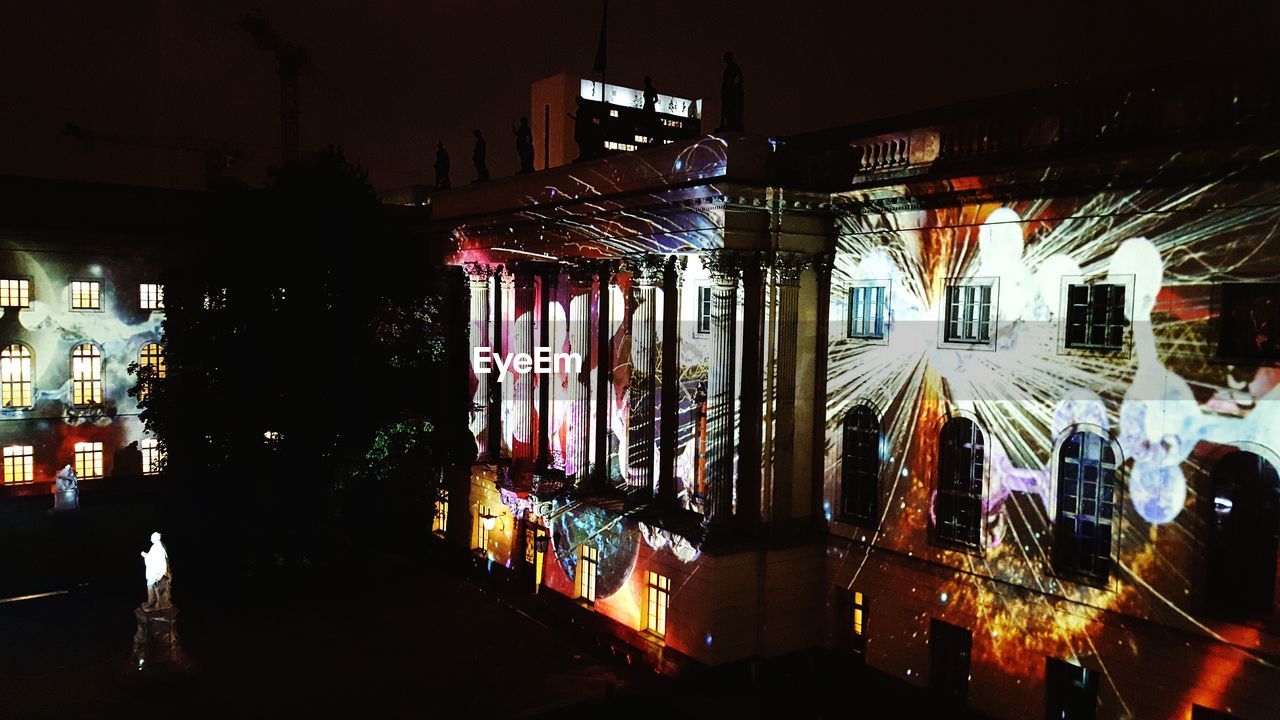 Graffiti on building wall at night