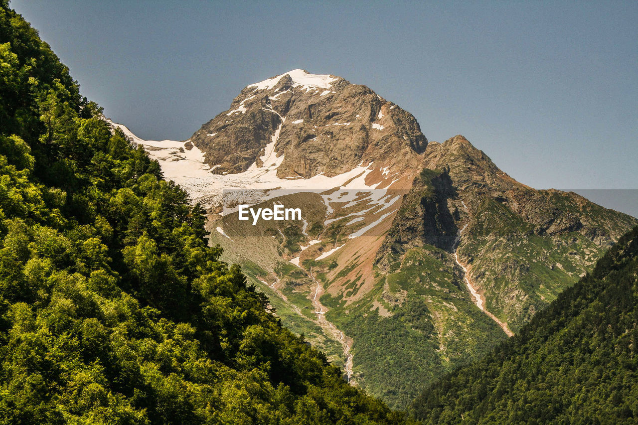 Scenic view of mountains against clear sky