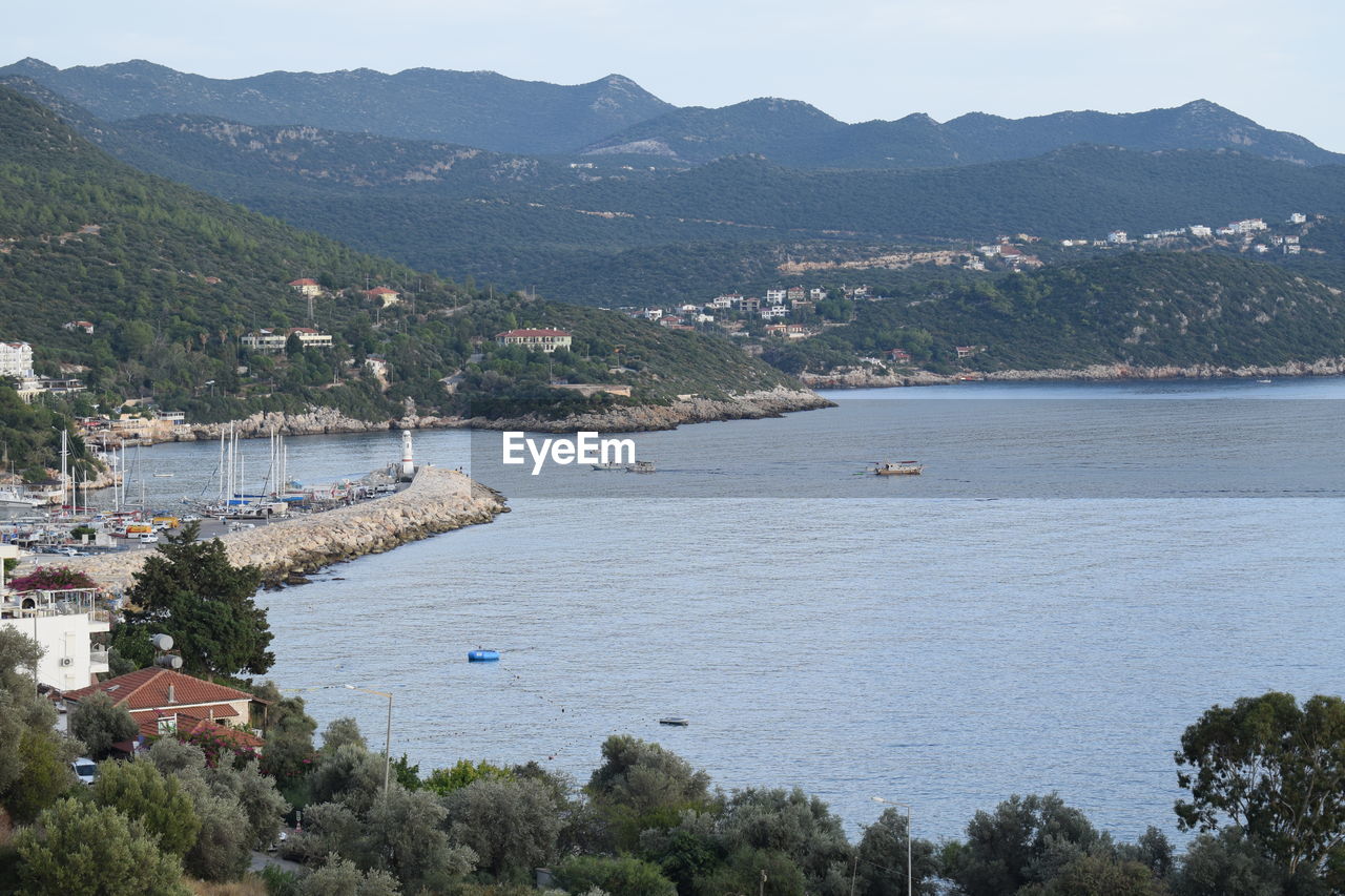 High angle view of sea by mountains