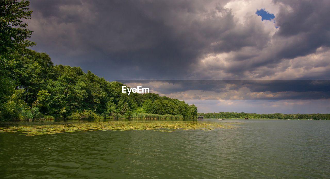Scenic view of river against sky