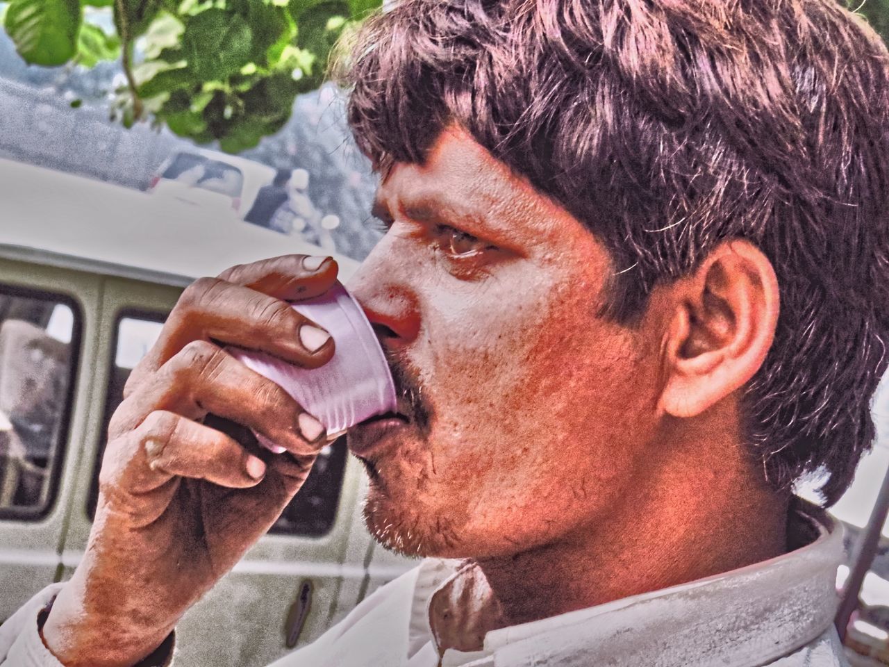 CLOSE-UP OF MAN EATING ICE CREAM