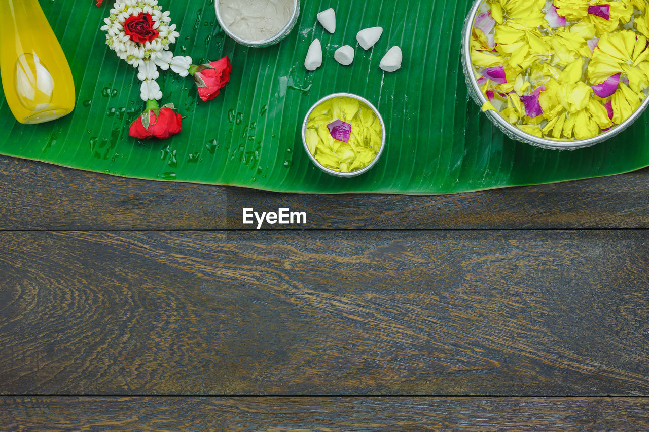 High angle view of religious offerings on leaf at table