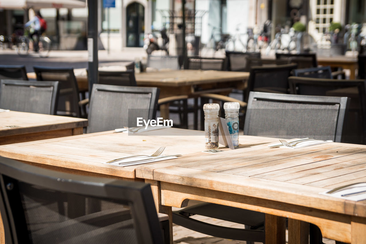 Empty chairs and tables at cafe