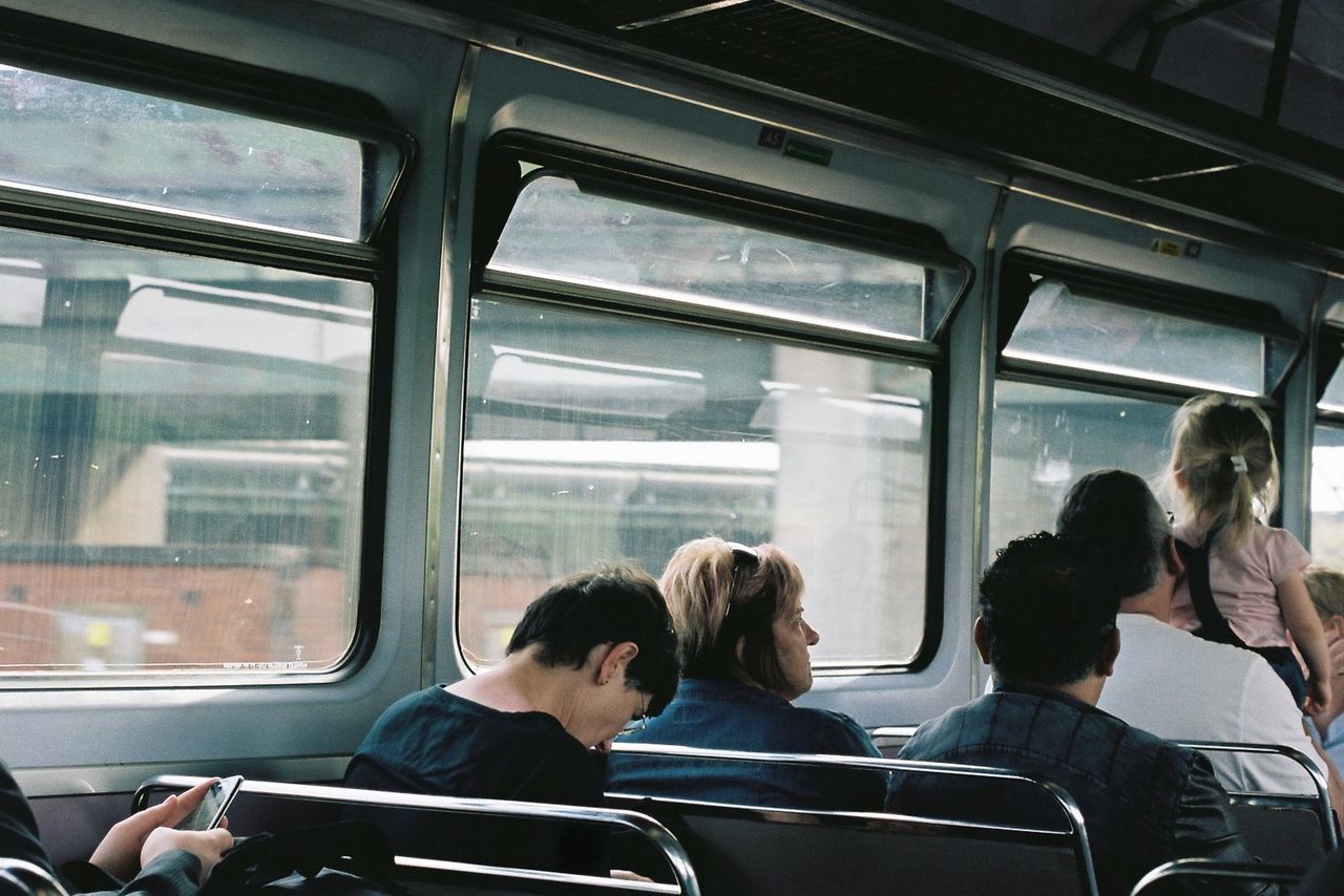 PEOPLE TRAVELING IN TRAIN