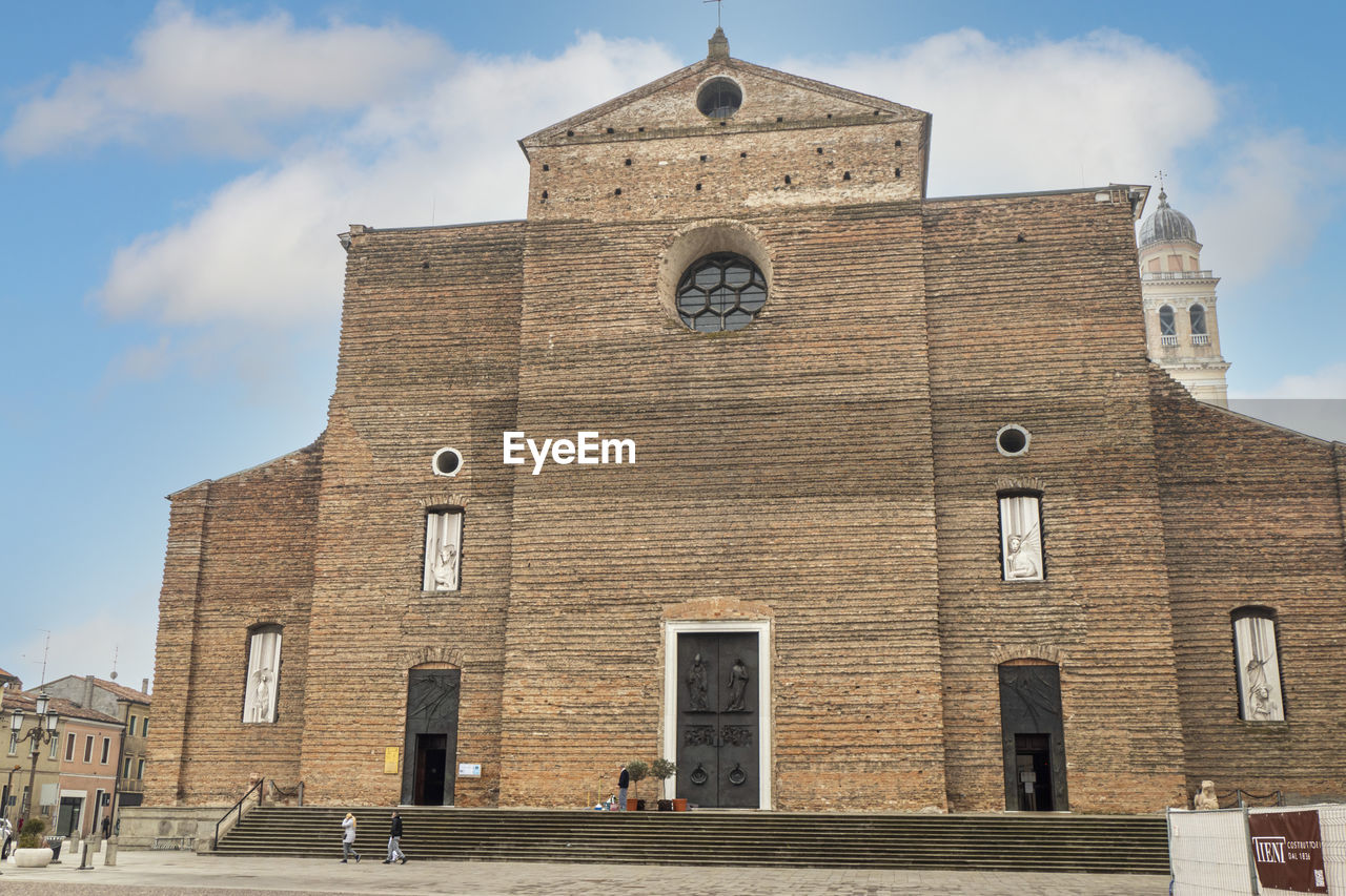 architecture, building exterior, built structure, building, sky, religion, place of worship, history, the past, travel destinations, tower, belief, nature, city, travel, spirituality, cloud, tourism, day, landmark, facade, clock, outdoors, catholicism, group of people, town, time, low angle view, street