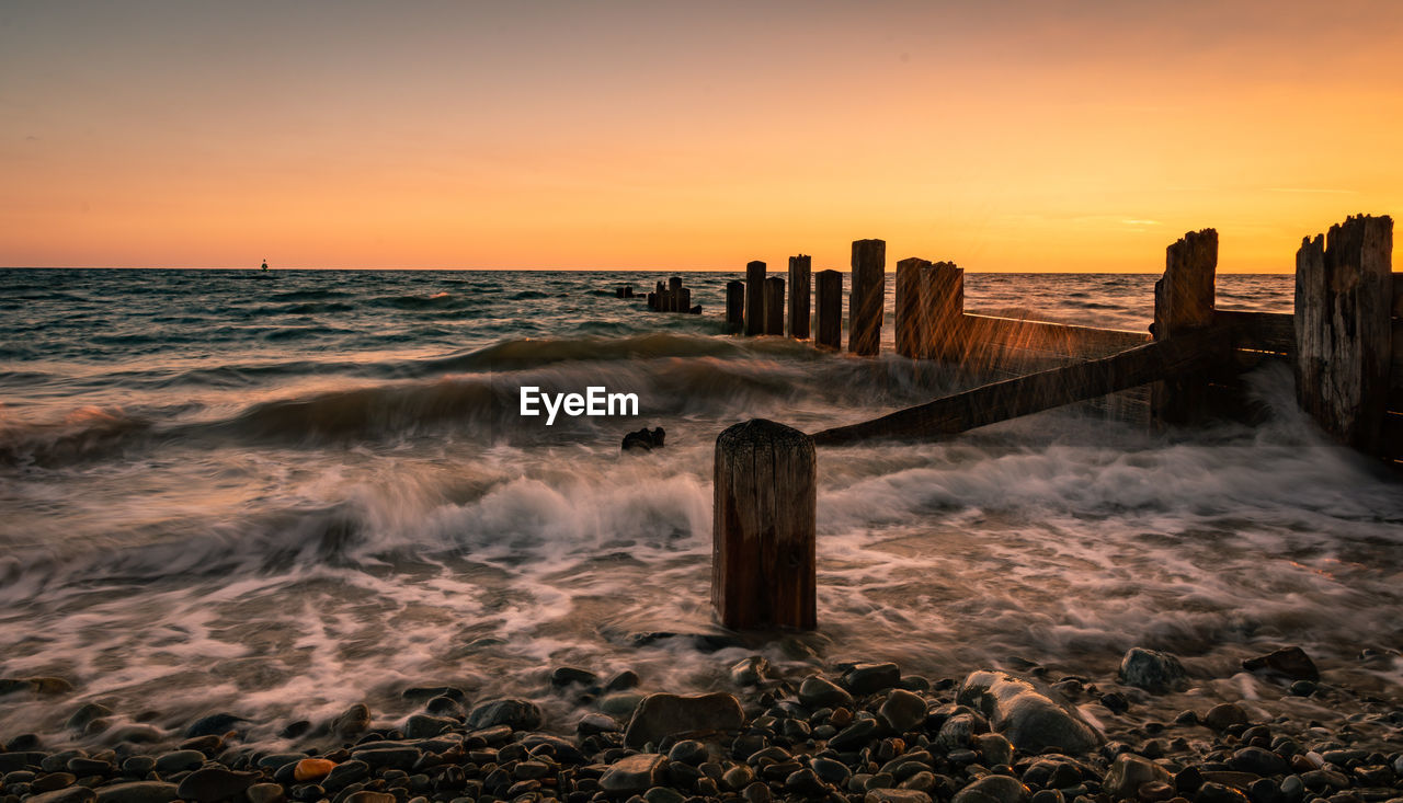 Scenic view of sea against sky during sunset