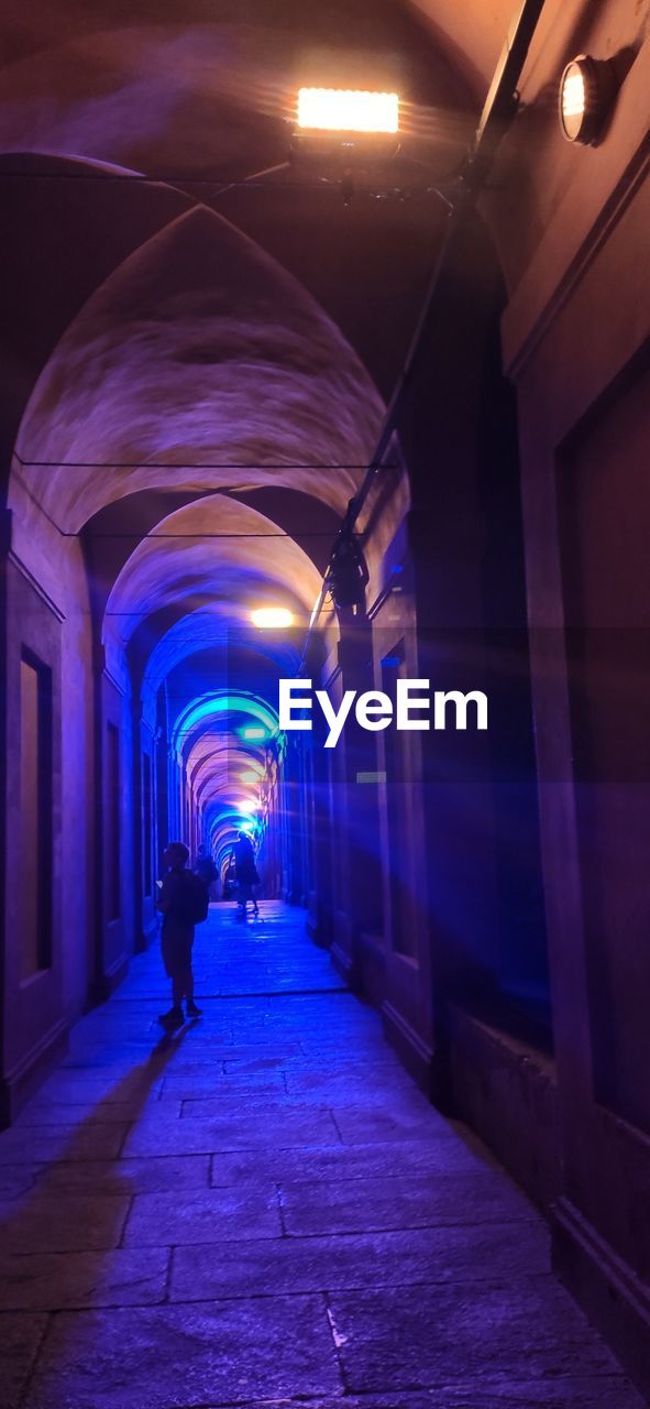 light, blue, architecture, indoors, tunnel, illuminated, darkness, lighting equipment, staircase, lighting, built structure, night, light - natural phenomenon, steps and staircases, infrastructure, space, technology, no people