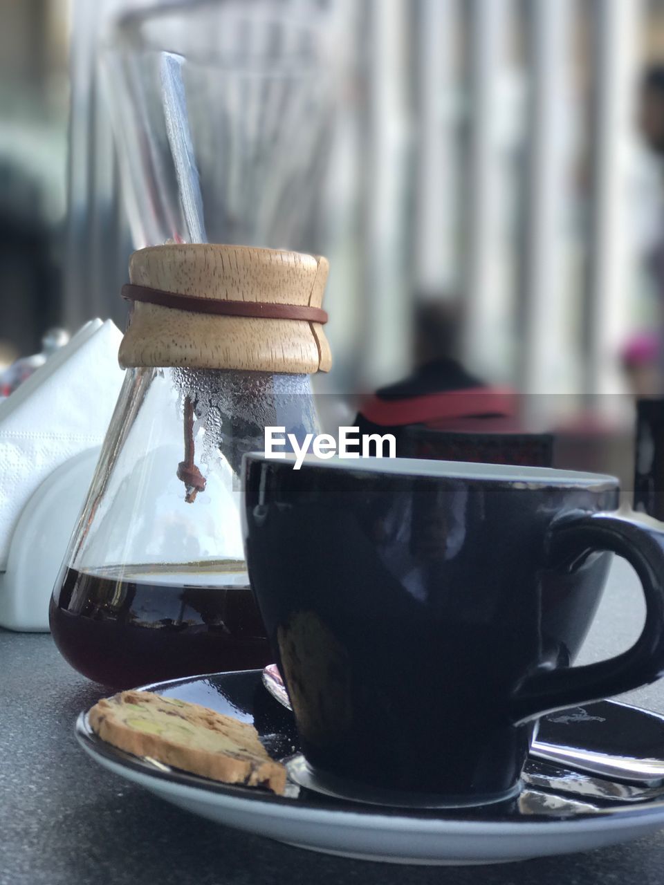 CLOSE-UP OF DRINK IN GLASS ON TABLE