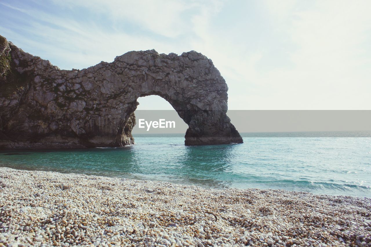 Arch formed by rock in sea