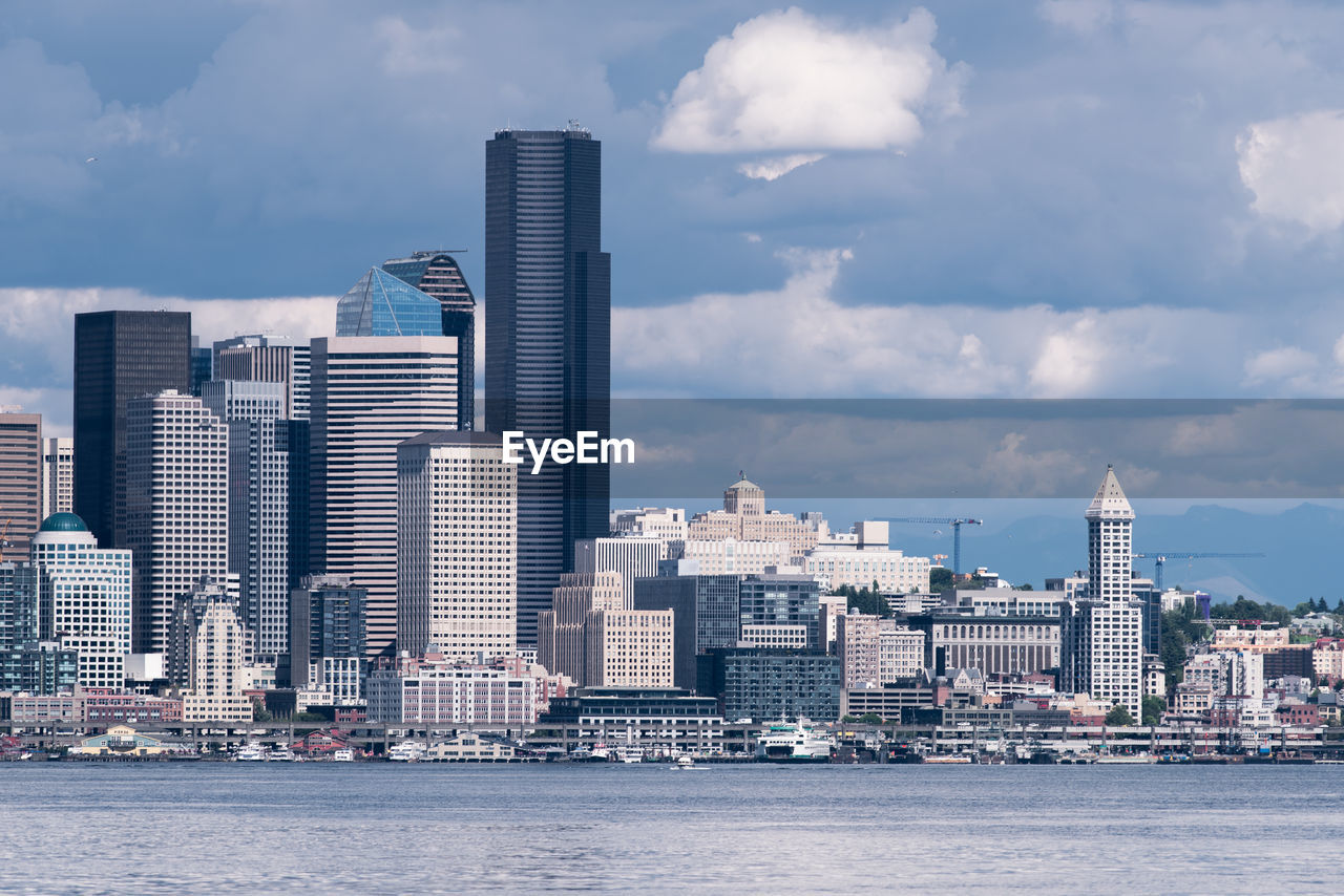 Modern buildings in city against sky