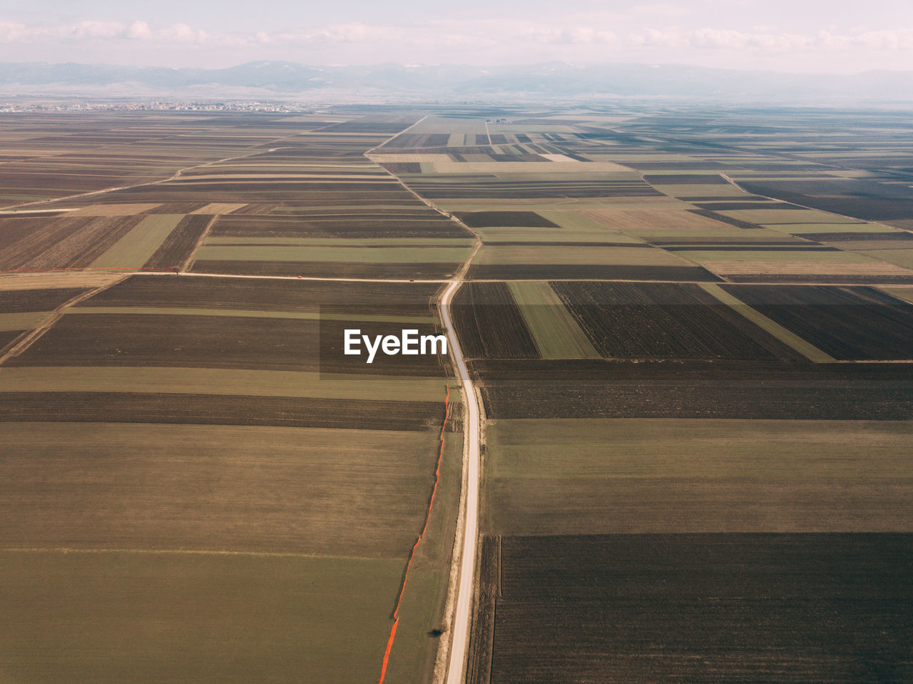 Aerial view of agricultural field against sky