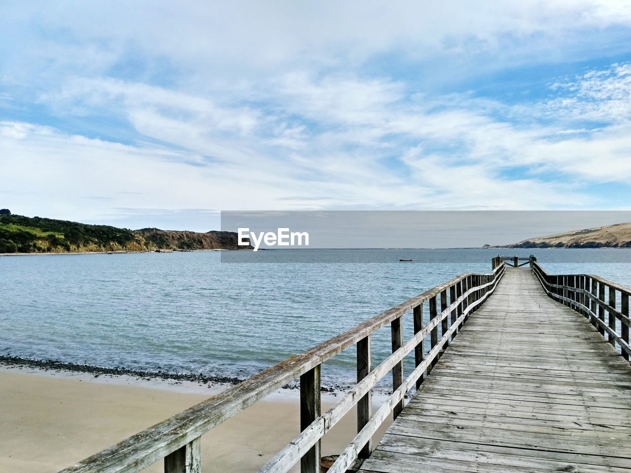 Pier over sea against sky